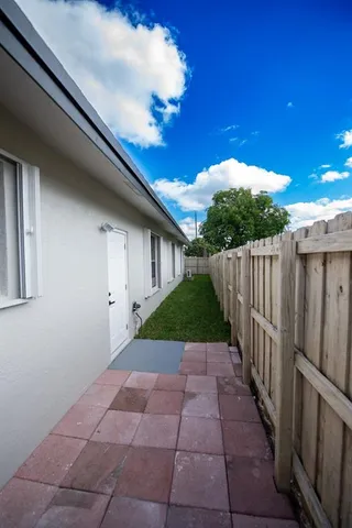 a view of a house with a yard and garage
