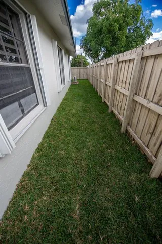 a kitchen with stainless steel appliances a sink stove and cabinets