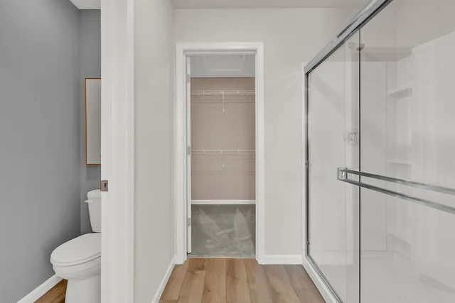 a bathroom with a shower and a toilet