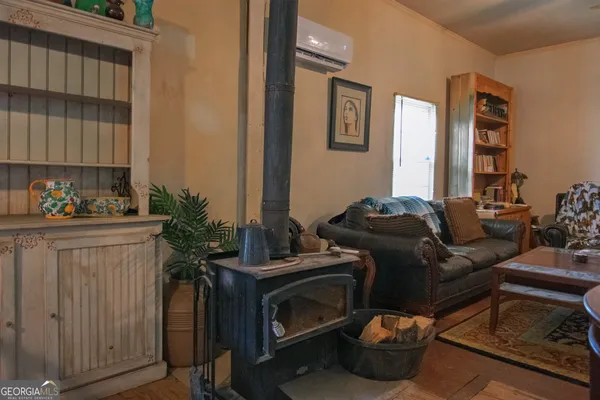 a living room with furniture window and potted plant