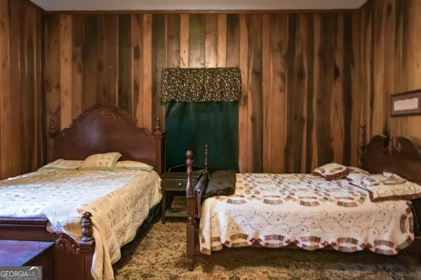 a bedroom with bed and window