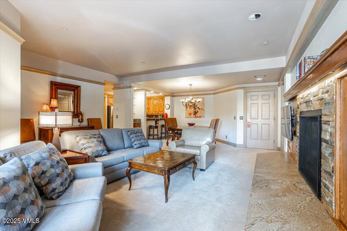46 Avondale Lane, Unit R312 Beaver Creek, CO 81620 - Photo 14 of 47 a living room with furniture and a fireplace