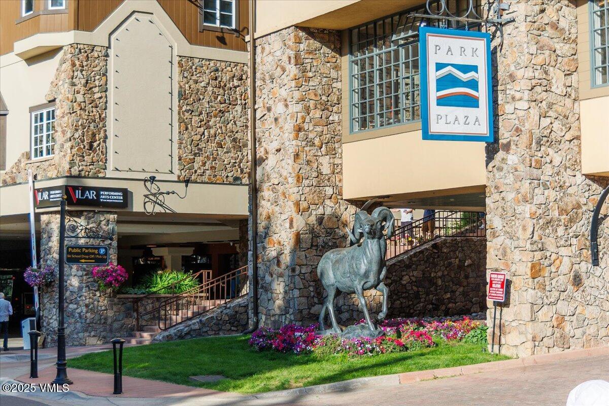 46 Avondale Lane, Unit R312 Beaver Creek, CO 81620 - Photo 32 of 47 a front view of a house with a yard and potted plants