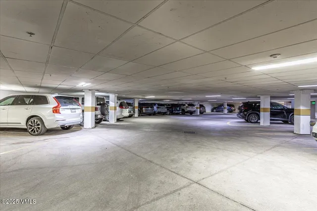 a view of a chairs and table in a backyard