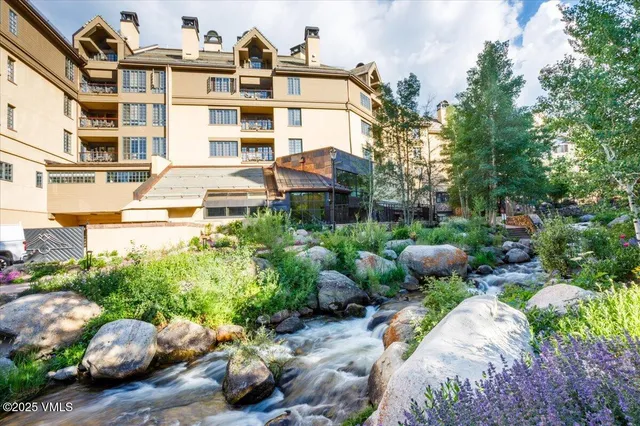 a view of a patio with couches chairs and a potted plant