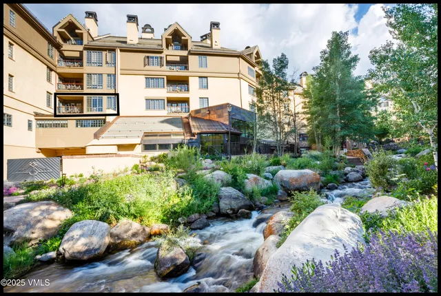 a view of a chairs and table in the balcony