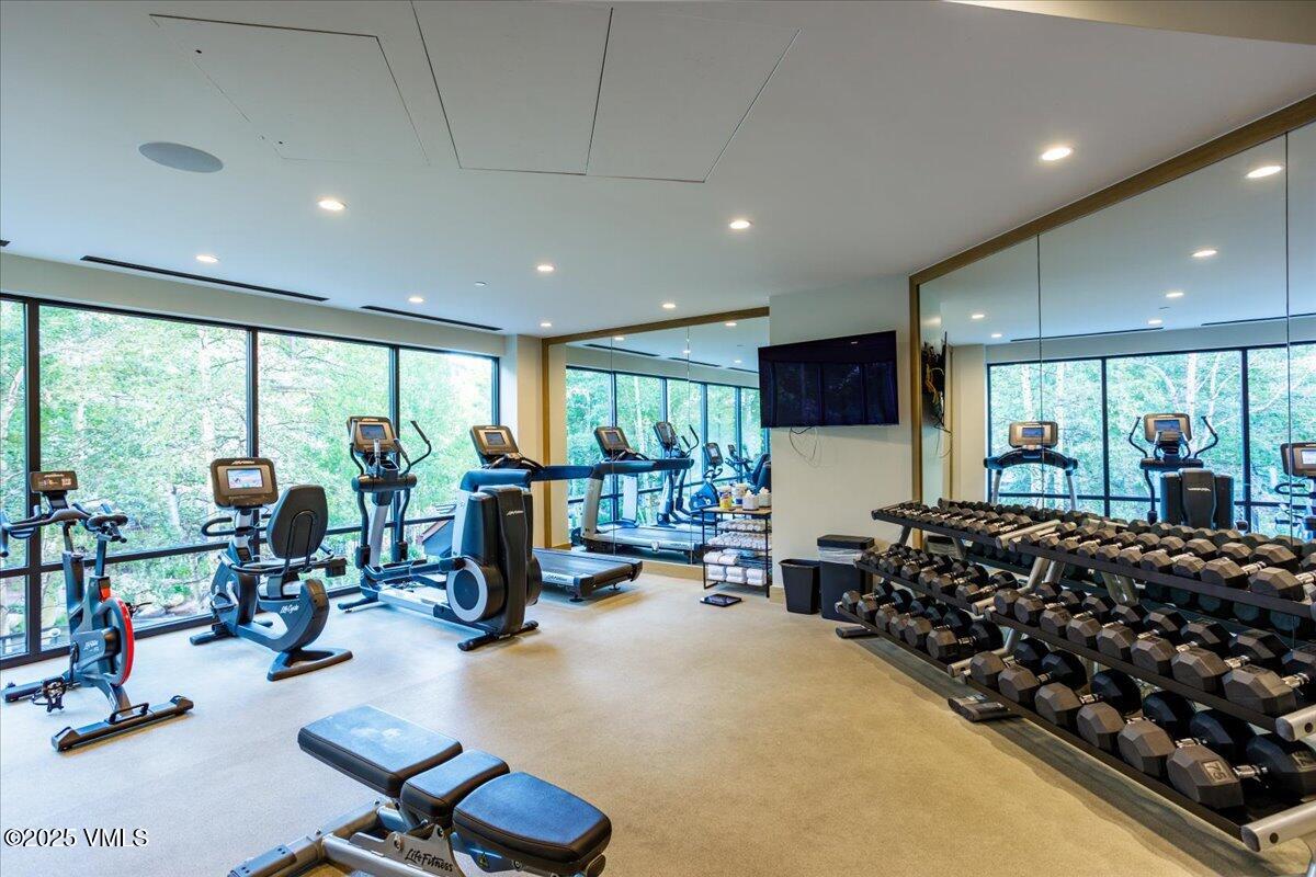 46 Avondale Lane, Unit R312 Beaver Creek, CO 81620 - Photo 42 of 47 a room with gym equipment and a large window