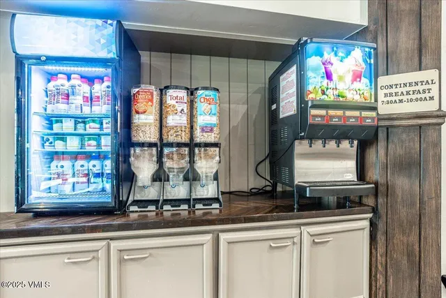 a living room with furniture a flat screen tv and a table