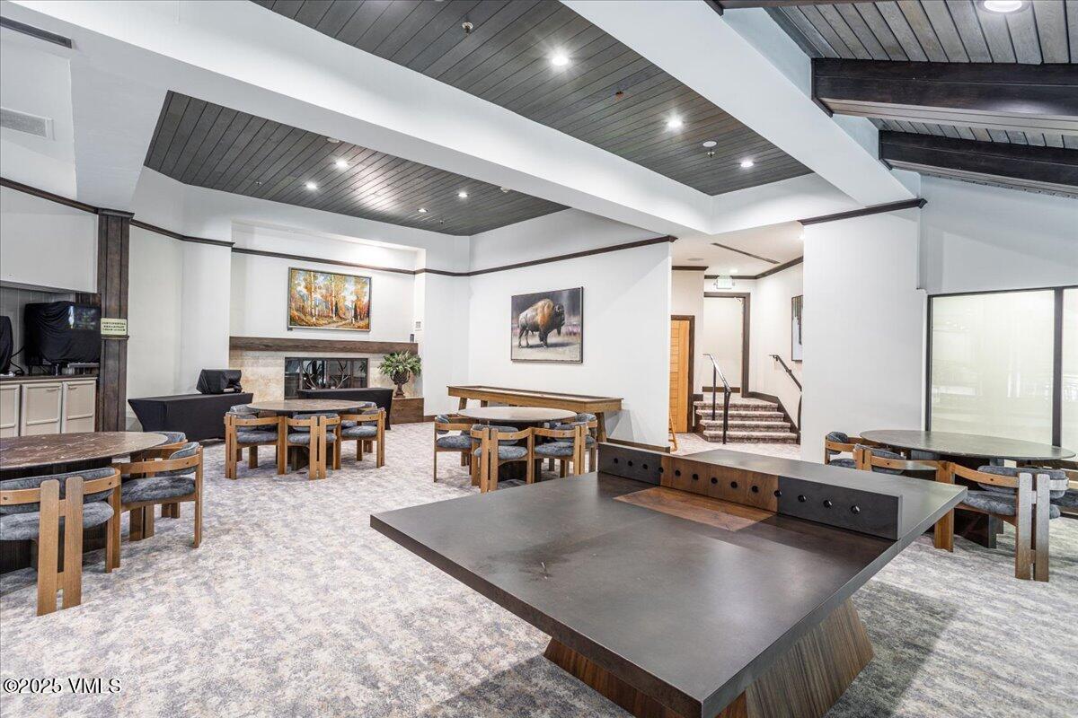 46 Avondale Lane, Unit R312 Beaver Creek, CO 81620 - Photo 47 of 47 a living room with furniture a flat screen tv and a table