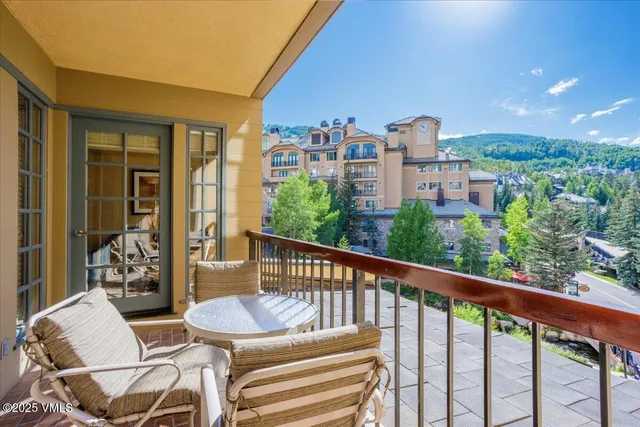 a view of a chairs and table in patio of a house