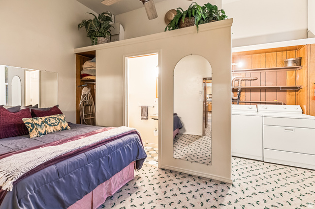 21 North Main Street Kingston, UT 84743 - Photo 73 of 107 Bedroom featuring connected bathroom, washer and dryer, and arched walkways