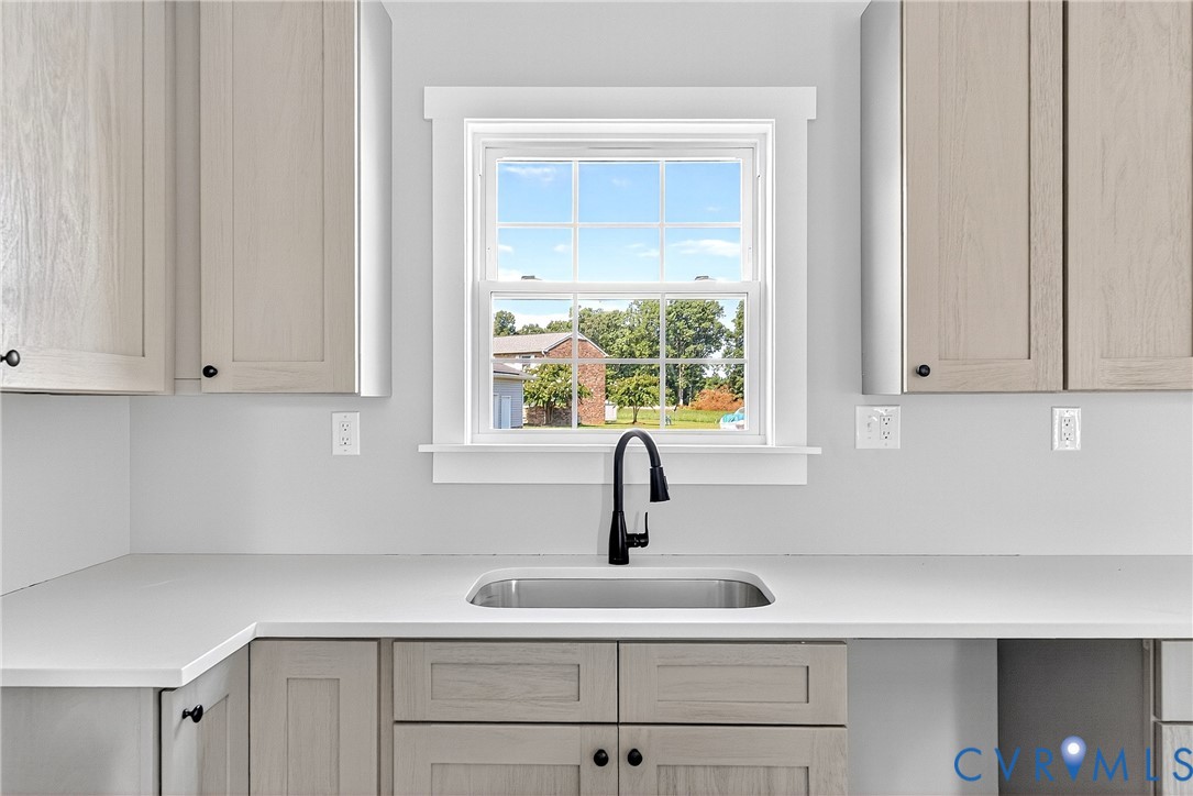 2732 Venter Road Aylett, VA 23009 - Photo 10 of 32 a kitchen with white cabinets and a window