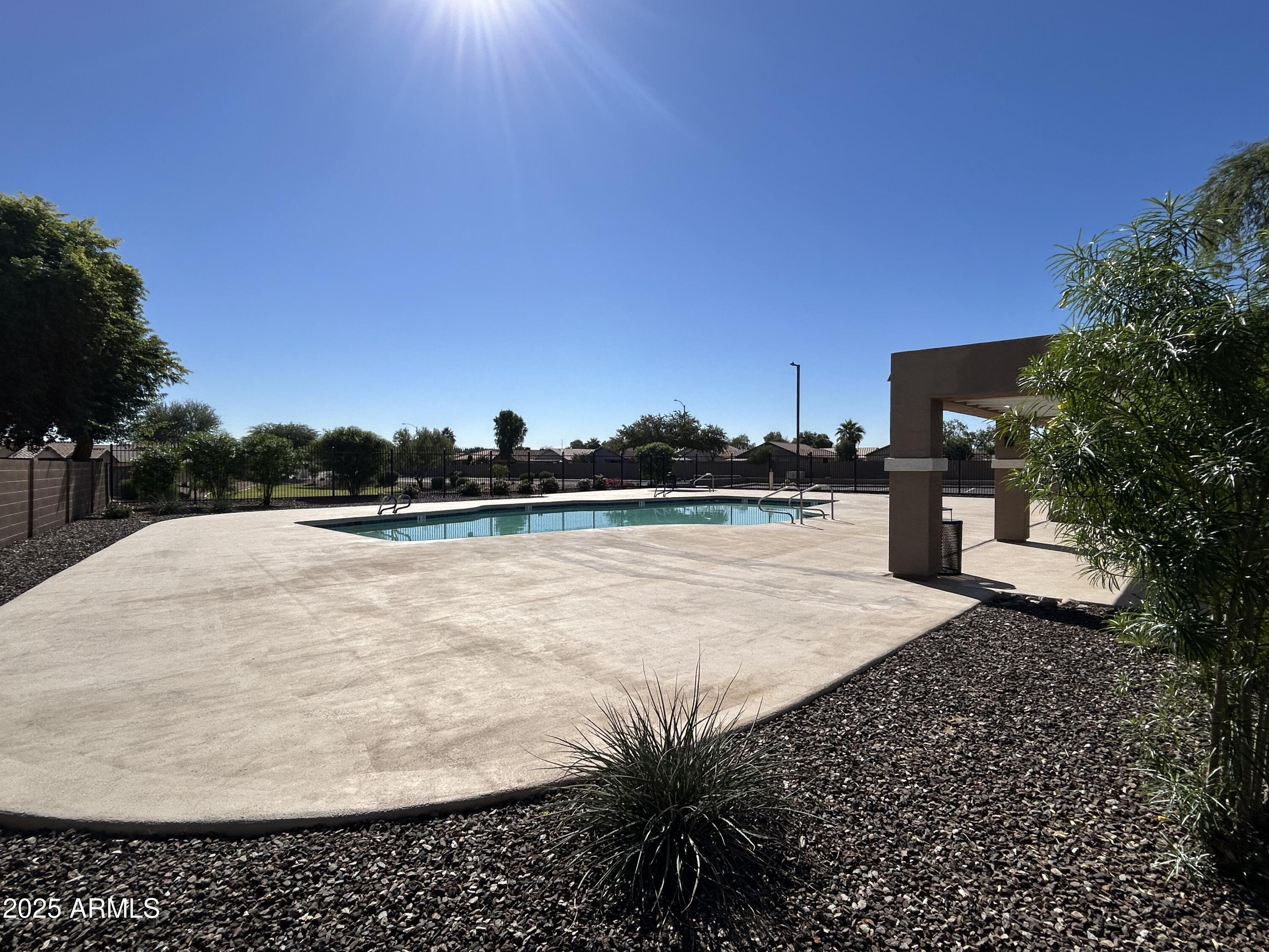 15011 West Redfield Road Surprise, AZ 85379 - Photo 16 of 16 a white house with a yard and lake view