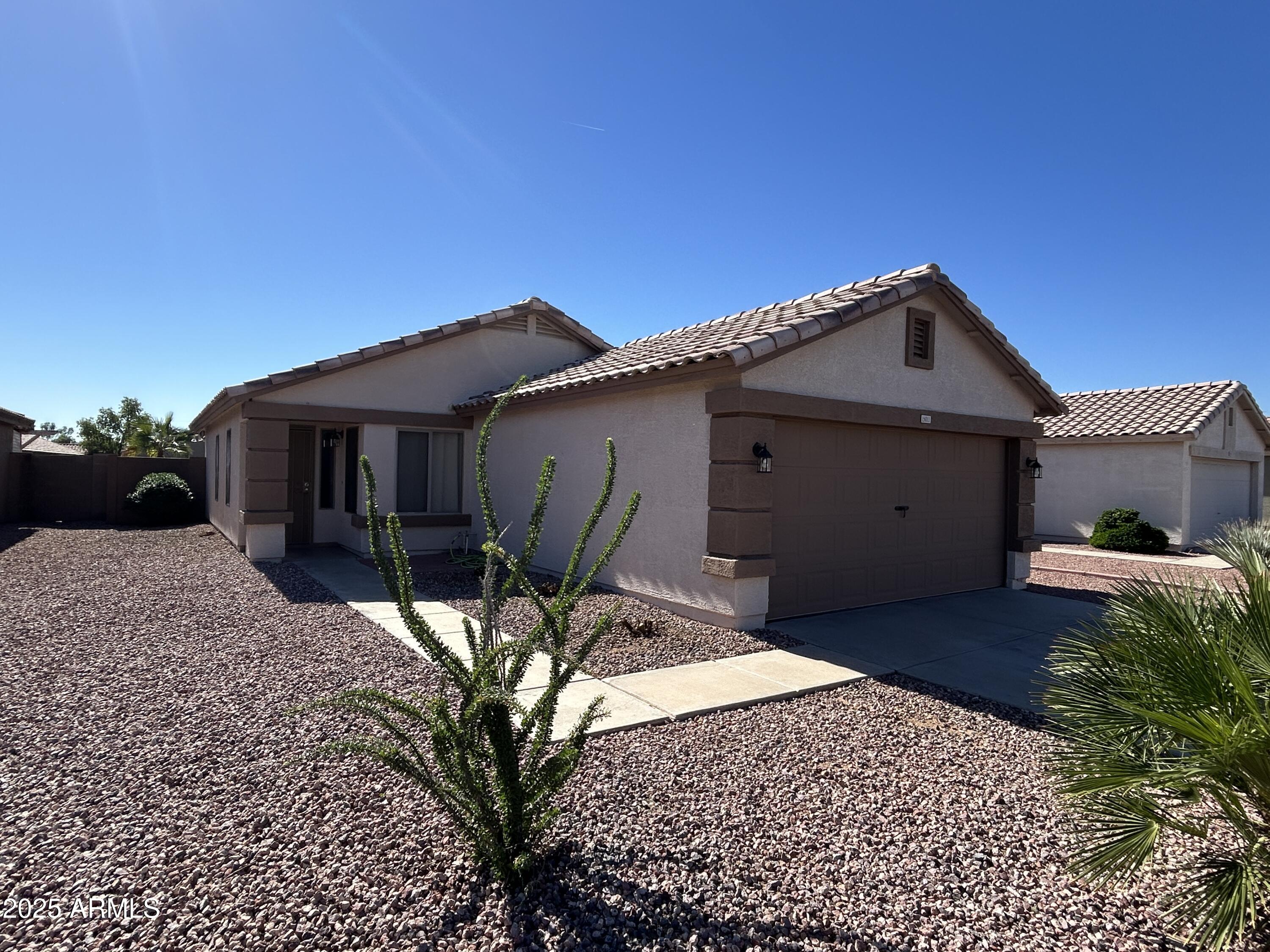 15011 West Redfield Road Surprise, AZ 85379 - Photo 2 of 16 a front view of a house with a yard