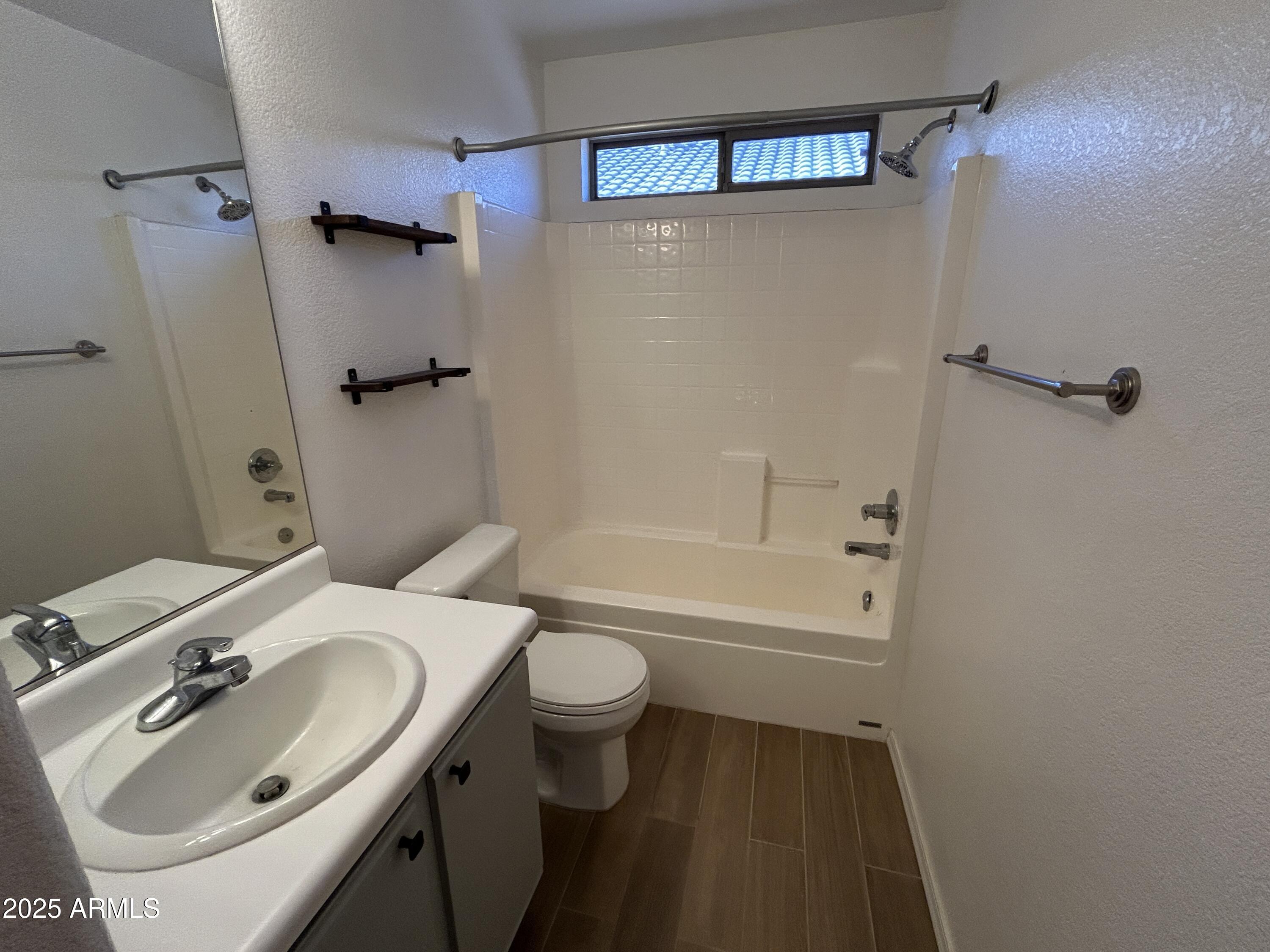 15011 West Redfield Road Surprise, AZ 85379 - Photo 6 of 16 a bathroom with a sink toilet and shower
