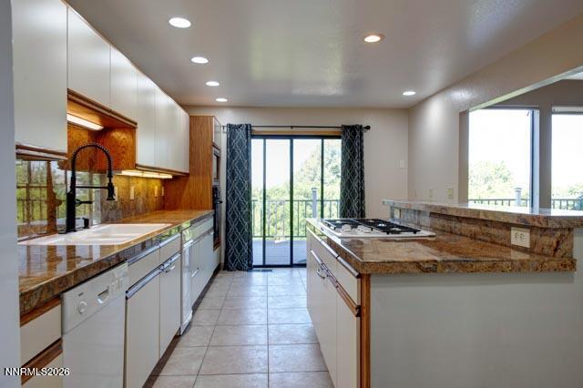 2640 Rockview Drive Reno, NV 89519 - Photo 21 of 56 a kitchen with a stove sink and cabinets