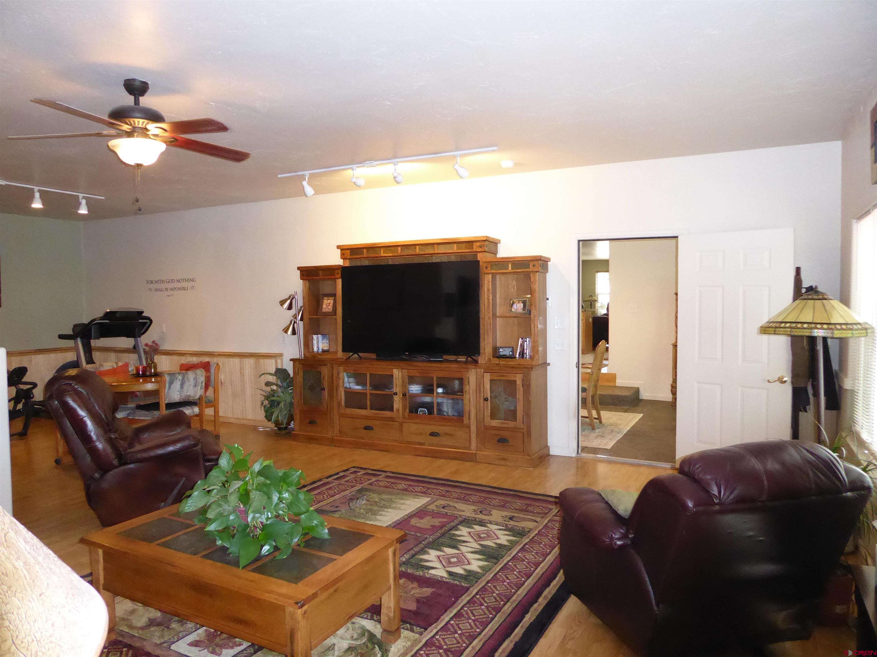 800 Northeast 2nd Street Cedaredge, CO 81413 - Photo 17 of 45 a living room with furniture and a flat screen tv