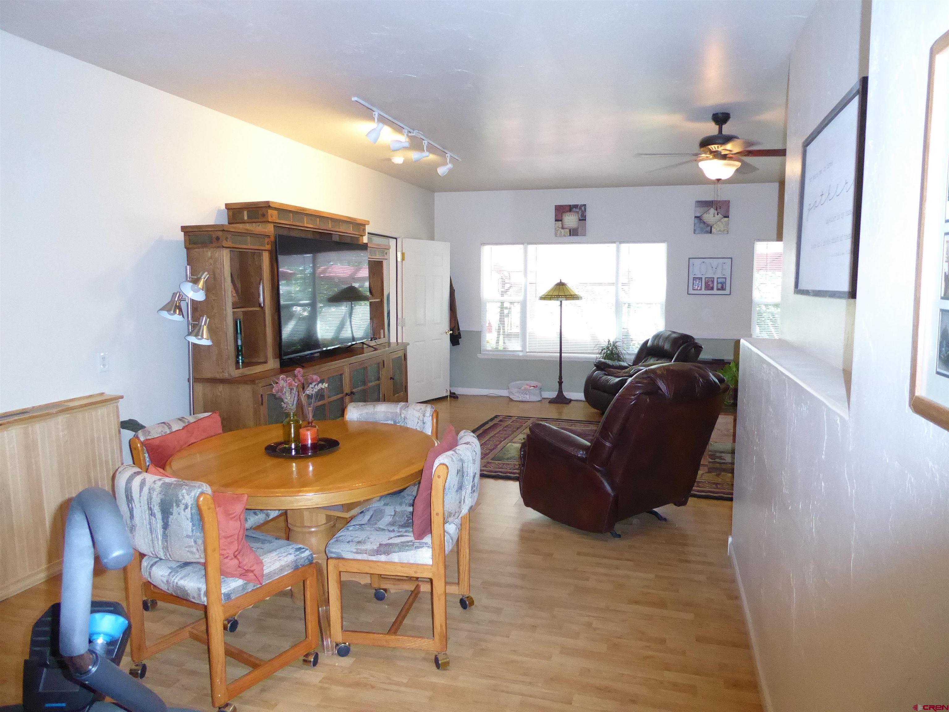 800 Northeast 2nd Street Cedaredge, CO 81413 - Photo 20 of 45 a living room with furniture and a dining table