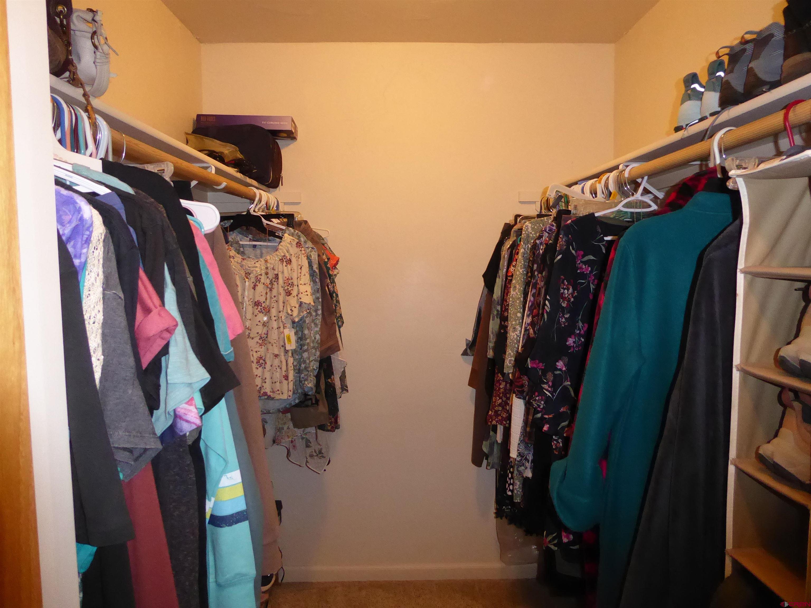 800 Northeast 2nd Street Cedaredge, CO 81413 - Photo 26 of 45 a view of walk in closet with clothes and shoes