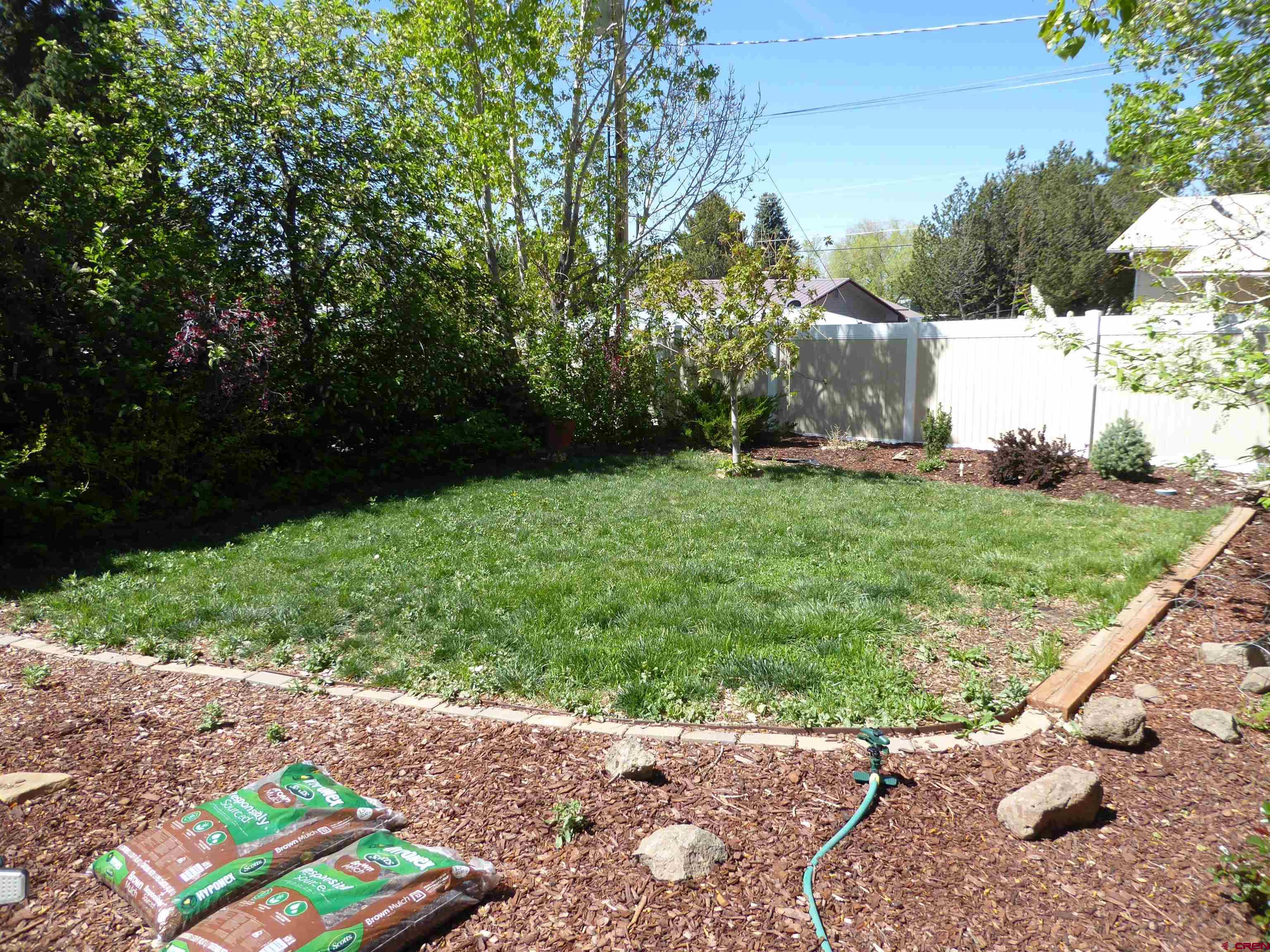 800 Northeast 2nd Street Cedaredge, CO 81413 - Photo 41 of 45 a backyard of a house with lots of green space