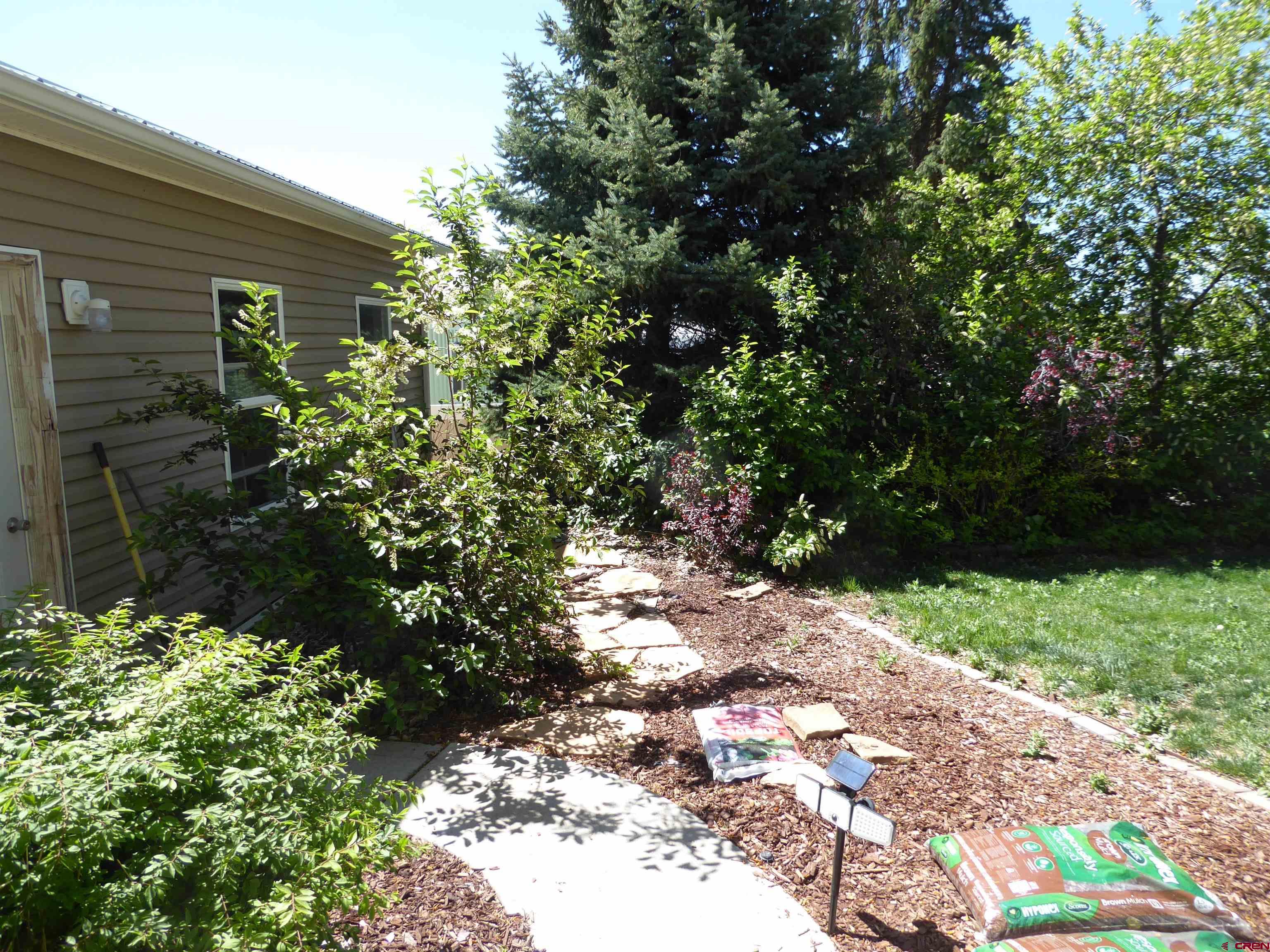 800 Northeast 2nd Street Cedaredge, CO 81413 - Photo 42 of 45 a backyard of a house with a yard