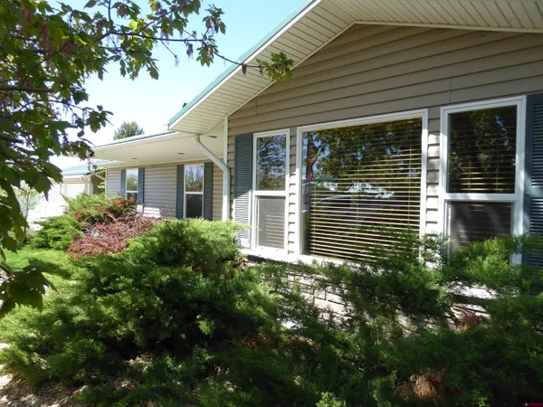 a view of a house with a tree