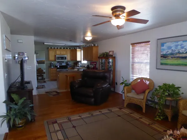 a kitchen with stainless steel appliances granite countertop a sink a stove top oven a counter space and cabinets