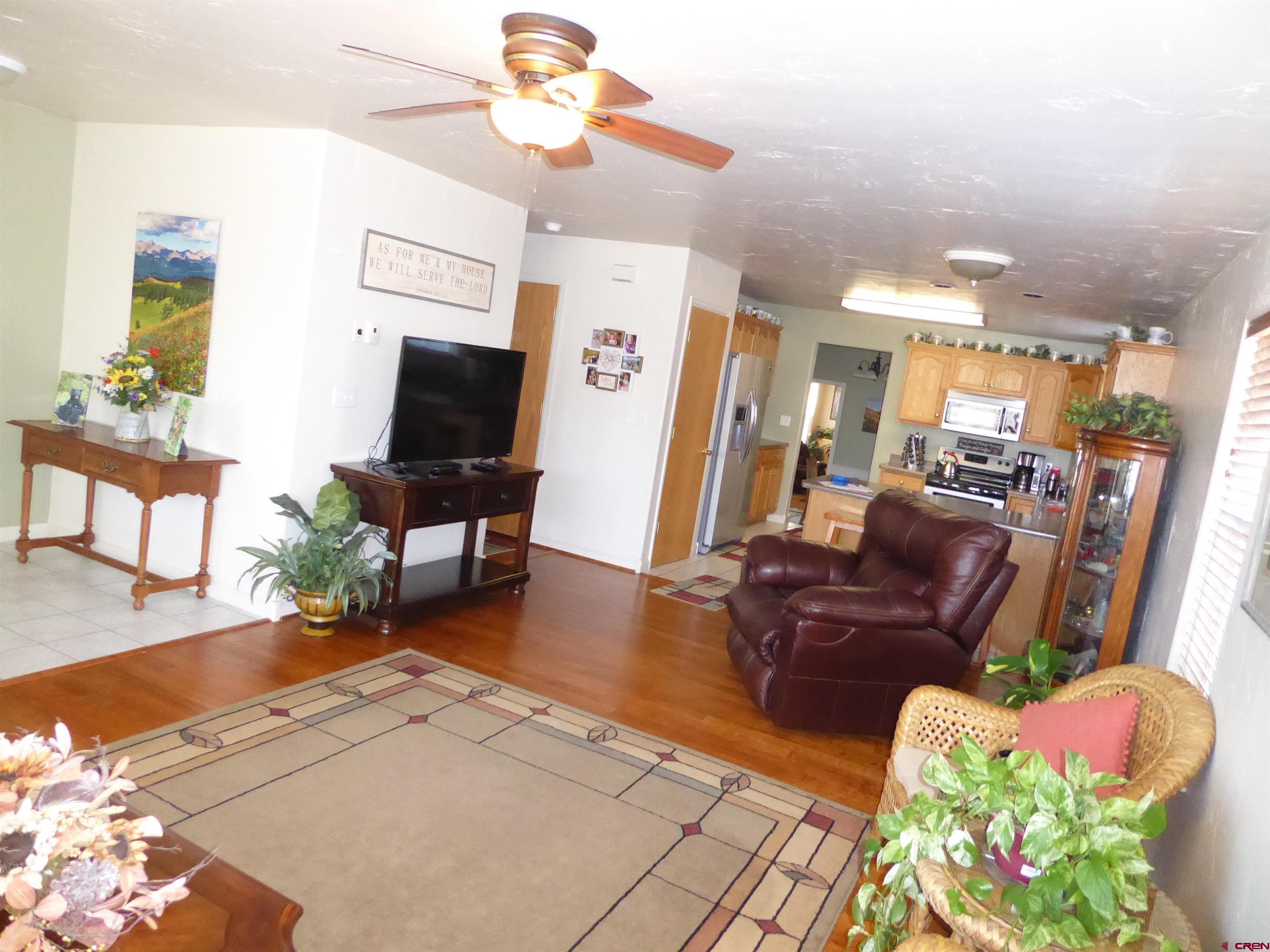 800 Northeast 2nd Street Cedaredge, CO 81413 - Photo 10 of 45 a living room with furniture and a flat screen tv