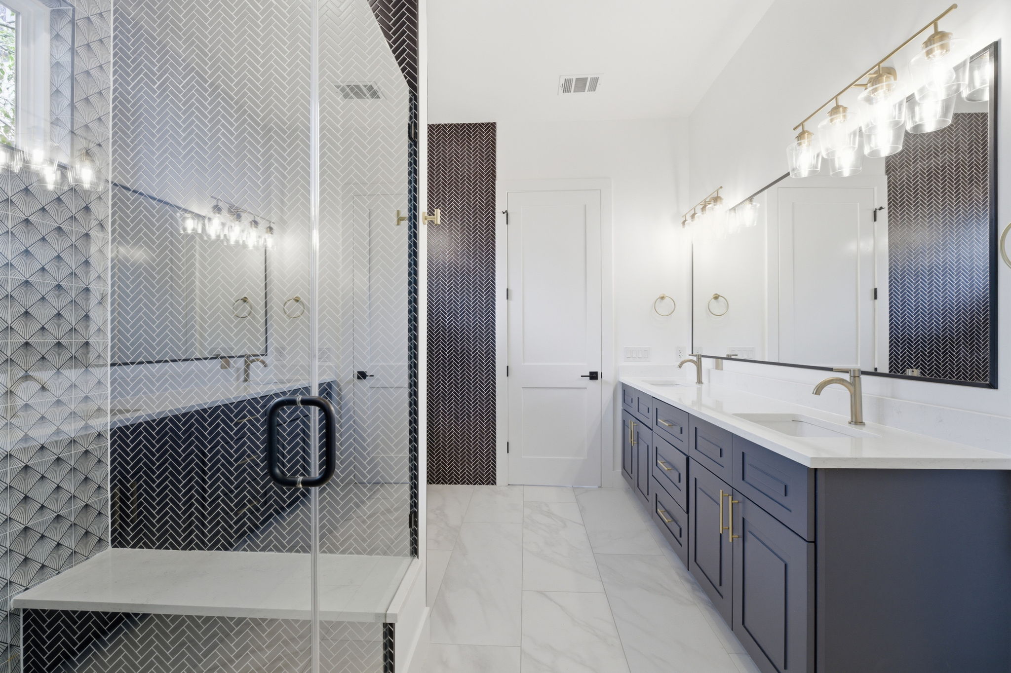400 Post Rd Drive Austin, TX 78704 - Photo 12 of 23 Full bath featuring double vanity, a shower stall, and light marble finish flooring