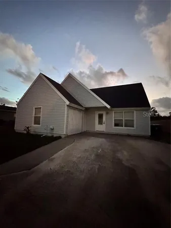 a front view of house with garage