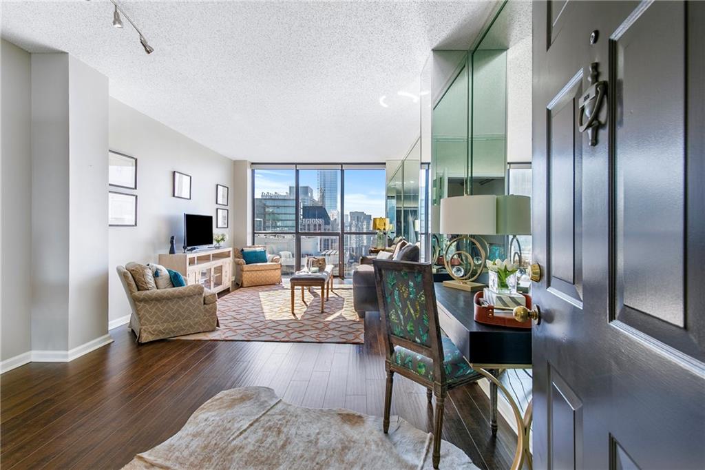 a living room with furniture and a large window