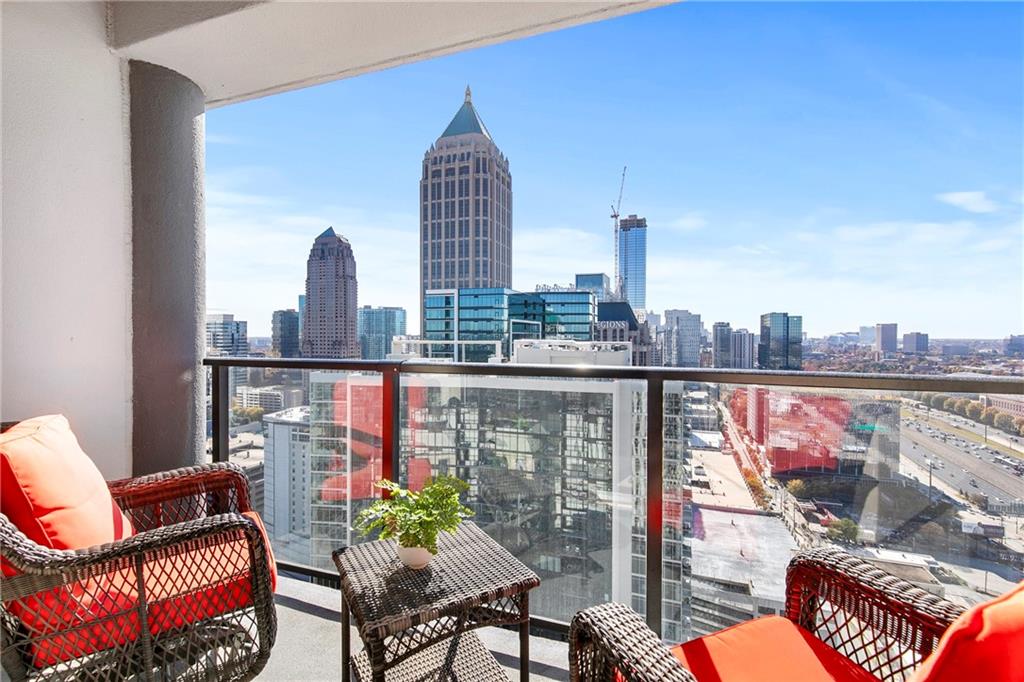 1280 West Peachtree Street Northwest, Unit 3806 Atlanta, GA 30309 - Photo 12 of 35 a view of roof deck with chair and a potted plant