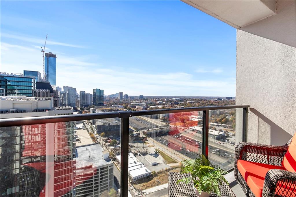 1280 West Peachtree Street Northwest, Unit 3806 Atlanta, GA 30309 - Photo 13 of 35 a view of a city skyline from a balcony