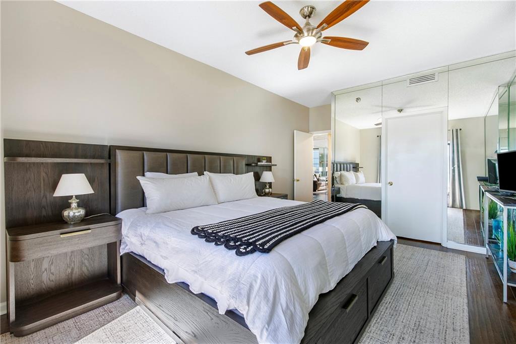 1280 West Peachtree Street Northwest, Unit 3806 Atlanta, GA 30309 - Photo 15 of 35 a bedroom with a bed and a walk in closet