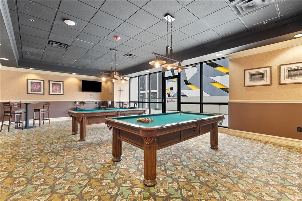 1280 West Peachtree Street Northwest, Unit 3806 Atlanta, GA 30309 - Photo 23 of 35 a reading room with furniture and a piano