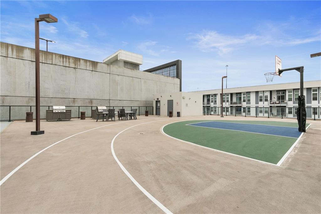1280 West Peachtree Street Northwest, Unit 3806 Atlanta, GA 30309 - Photo 30 of 35 a view of a swimming pool and a patio