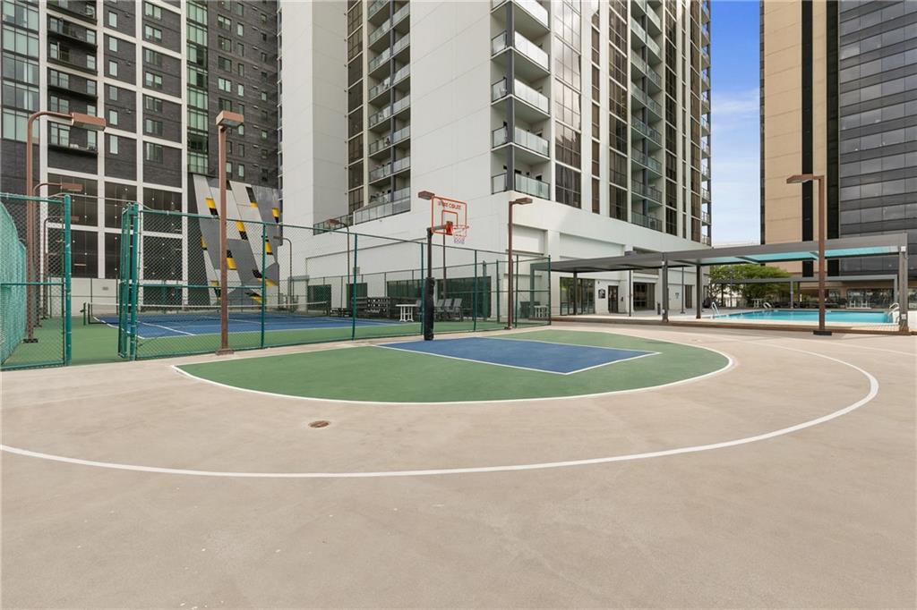 1280 West Peachtree Street Northwest, Unit 3806 Atlanta, GA 30309 - Photo 32 of 35 a view of a tall building next to a yard