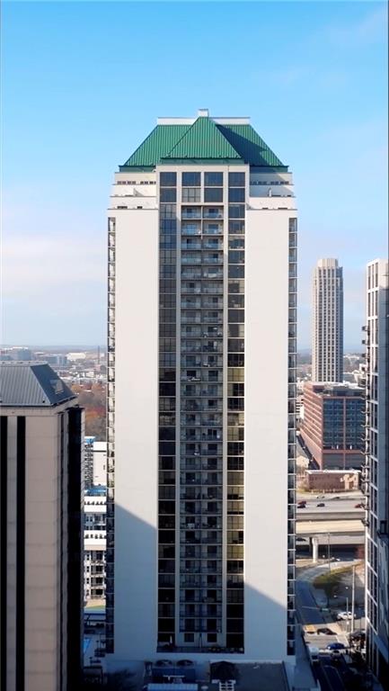 1280 West Peachtree Street Northwest, Unit 3806 Atlanta, GA 30309 - Photo 35 of 35 a front view of a building with glass windows