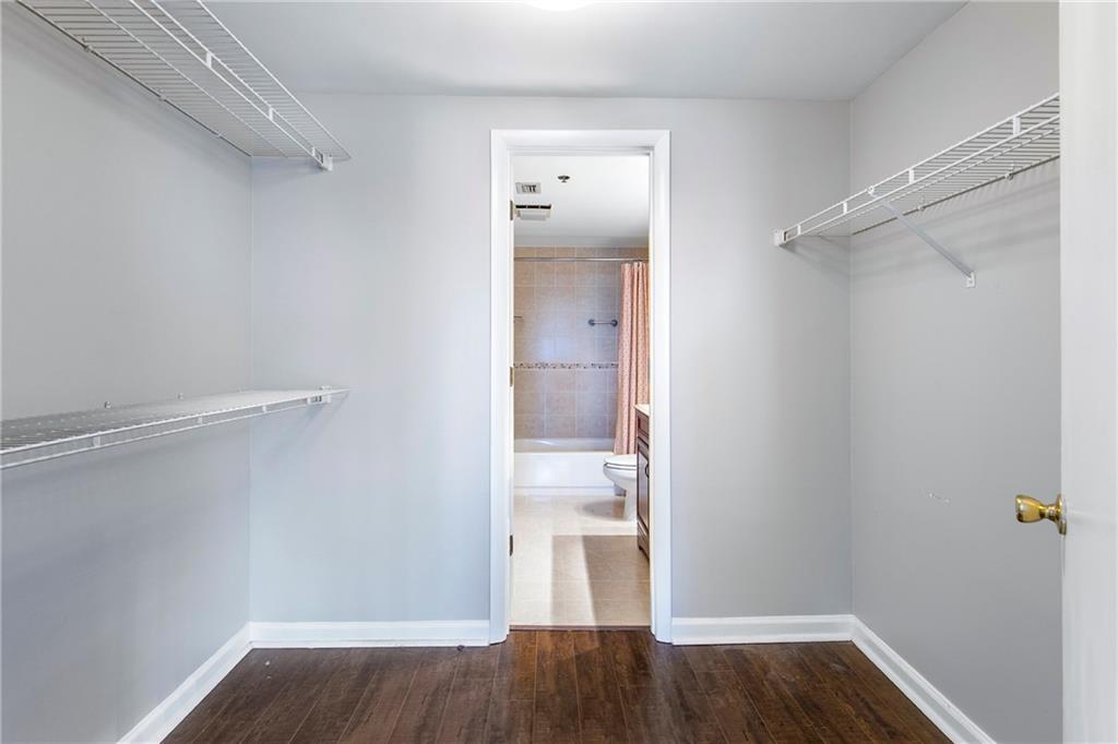 1280 West Peachtree Street Northwest, Unit 3806 Atlanta, GA 30309 - Photo 10 of 35 a view of walk in closet with wooden floor