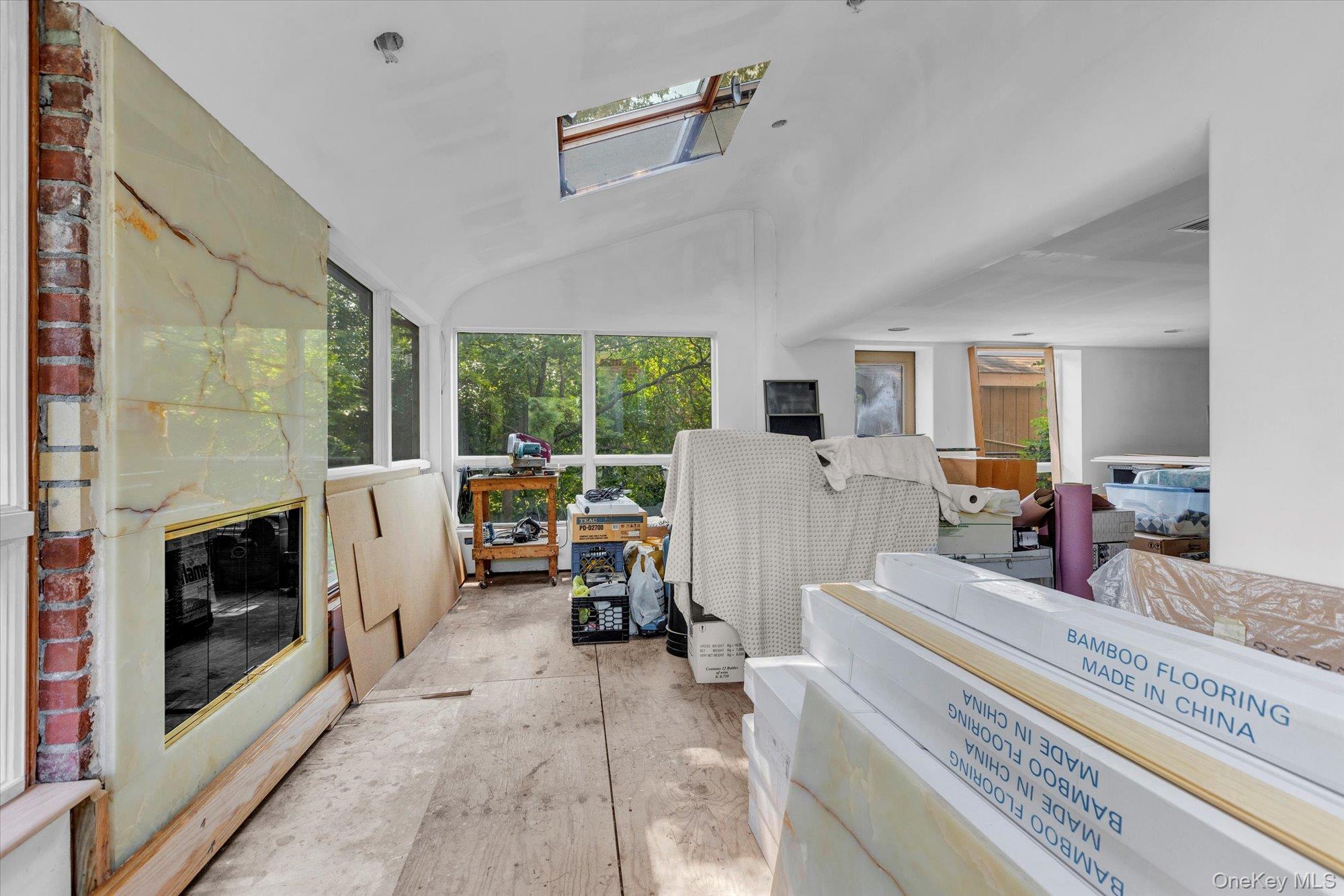 19 Clearland Road Syosset, NY 11791 - Photo 13 of 22 Sunroom featuring a skylight and lofted ceiling