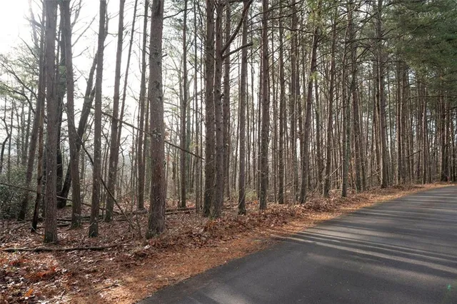 a view of a building with trees in the background