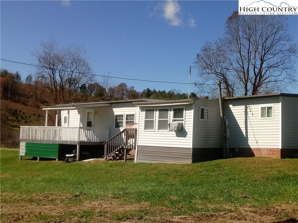 2449 Old Barrett Road Ennice, NC 28623 - Photo 11 of 12 a front view of house with yard and green space