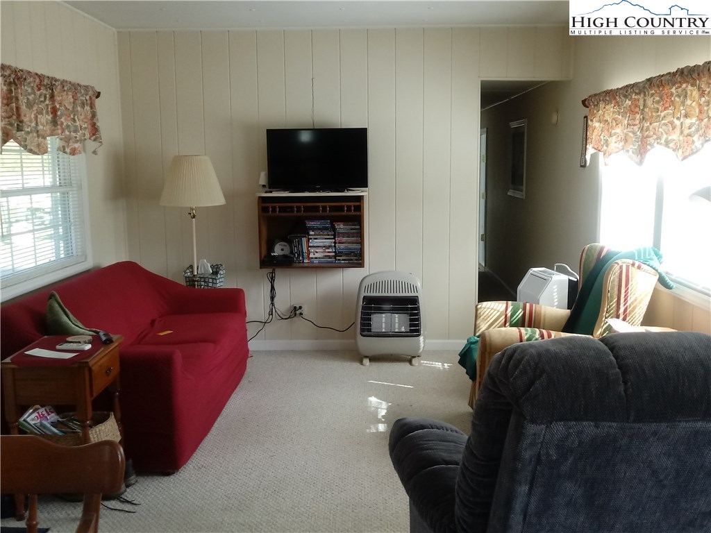 2449 Old Barrett Road Ennice, NC 28623 - Photo 3 of 12 a living room with furniture and a flat screen tv