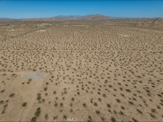 a view of a large body of water with a building in the background