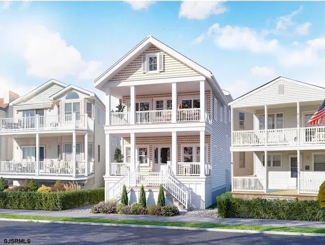 a front view of a residential apartment building with a yard