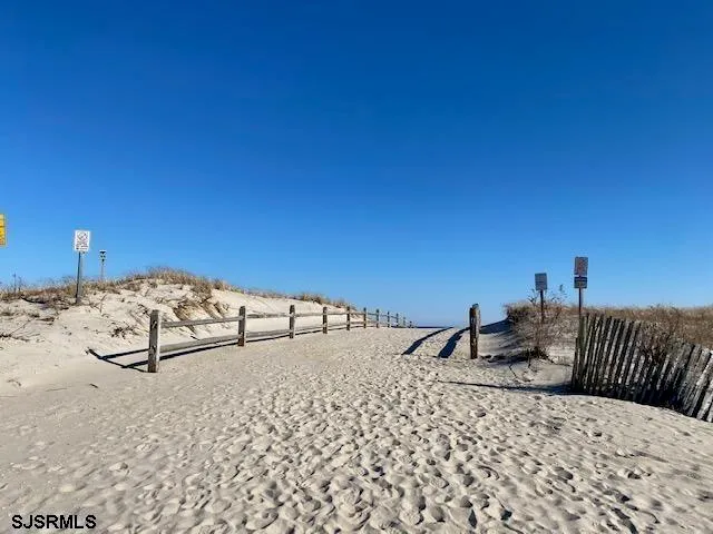 a bedroom with a bed and a night stand