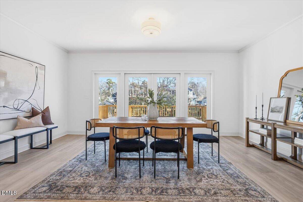 203 Baggett Avenue Raleigh, NC 27604 - Photo 13 of 45 a view of a dining room with furniture window and wooden floor