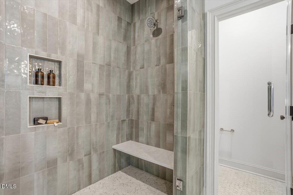 203 Baggett Avenue Raleigh, NC 27604 - Photo 21 of 45 a bathroom with a toilet and a shower