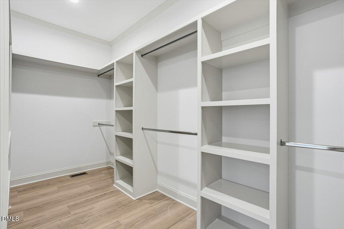 203 Baggett Avenue Raleigh, NC 27604 - Photo 22 of 45 a white refrigerator freezer and a wooden floor