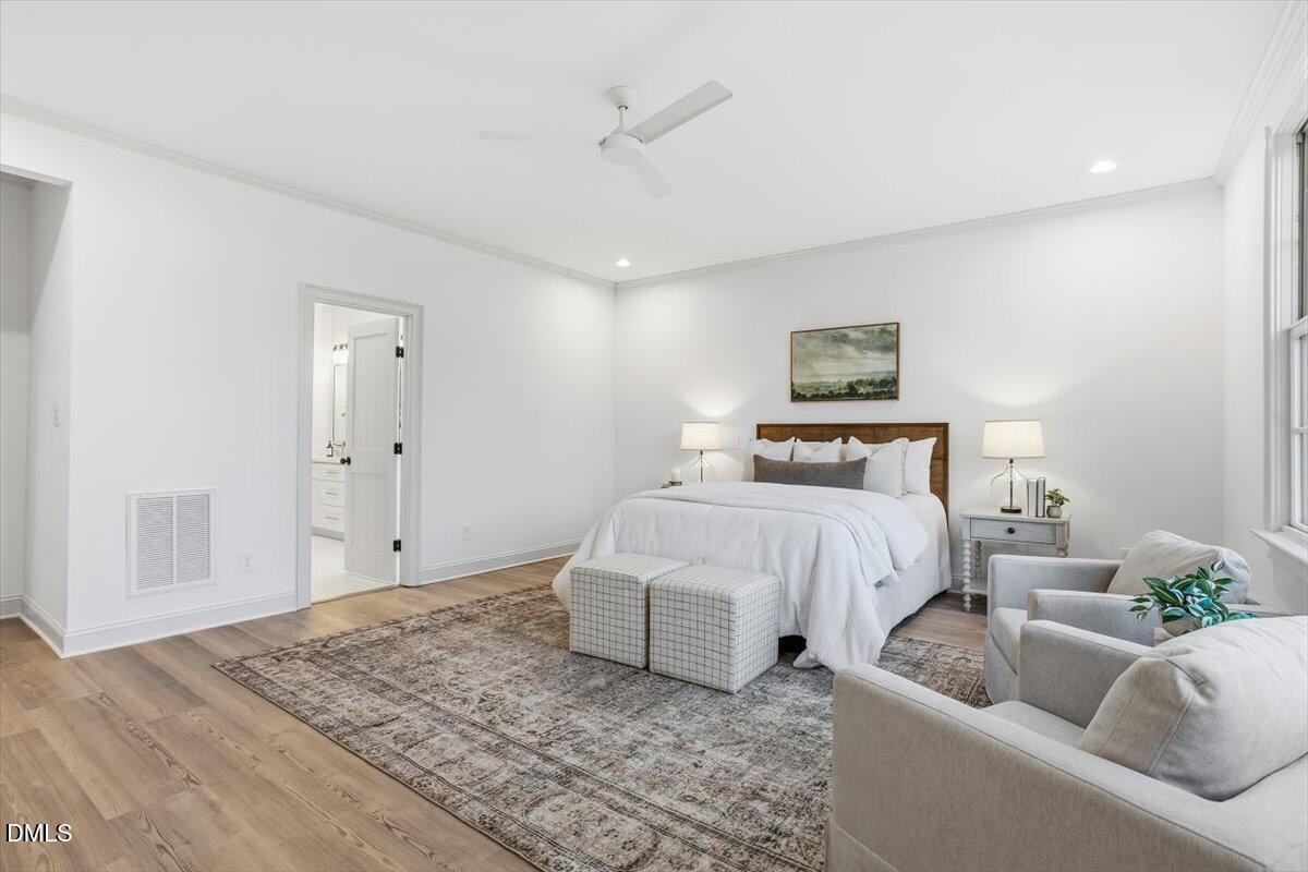 203 Baggett Avenue Raleigh, NC 27604 - Photo 22 of 51 a bedroom with bed and furniture